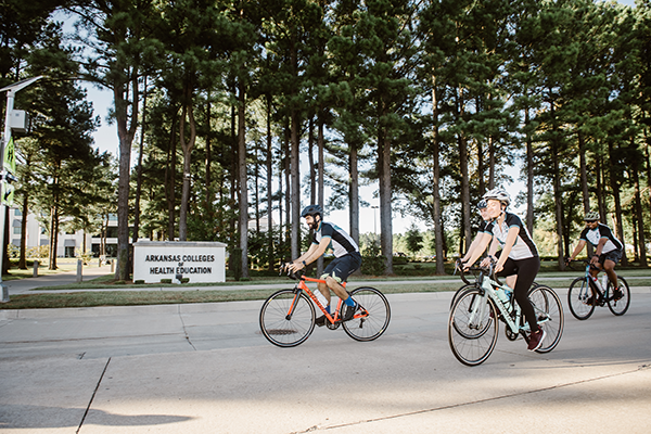 ARCOM Campus with students cycling by