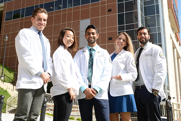 KYCOM students pose for the camera outside