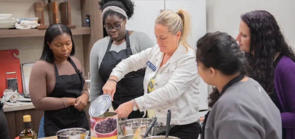 DO students learn hands on nutrition in a cooking class.