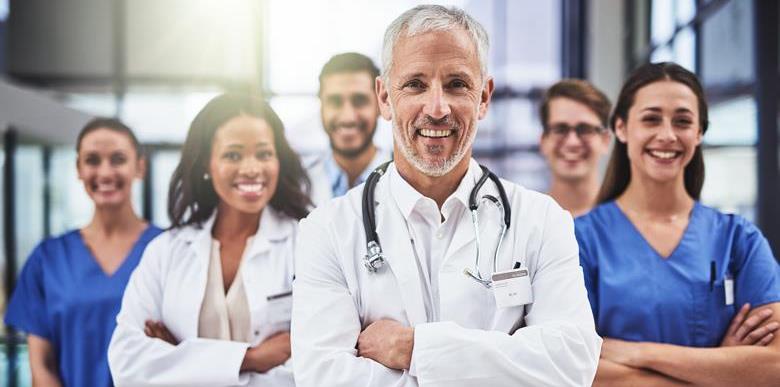 Group of smiling doctors facing the camera