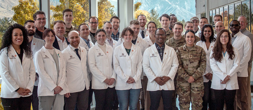 Smiling medical students in their white coats