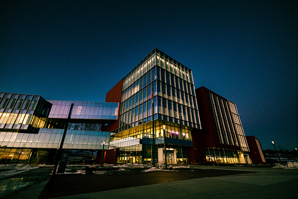 DMU-COM campus at night