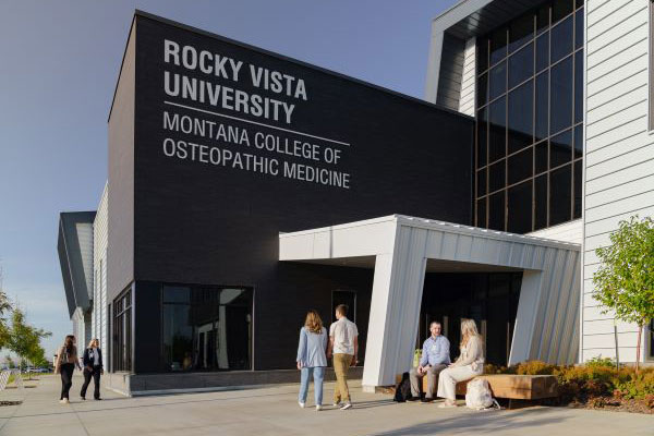 RVU-MCOM campus entrance features modern architecture.