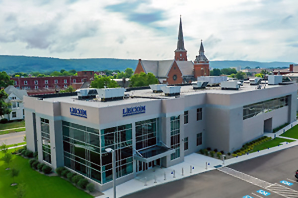 LECOM campus building with mountains in the background