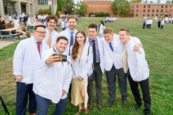 Medical Students taking a group selfie at WVSOM's White Coat ceremony