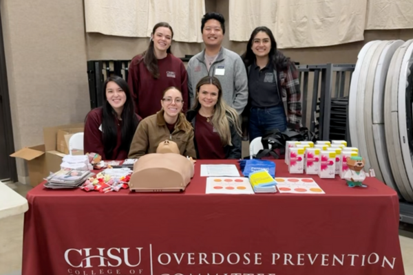 Student Groups Collaborate at MiMentor’s Community Health Fair. Standing left to right: Brooke Guenther, Phil De Vera and Negin Fadaee. Seated left to right: Savanna Lee, Giana Davlantes and Briana Anderson.