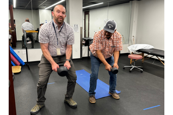 Dr. James Aston, the first performing arts medicine fellow turned faculty at UNT Health – TCOM in the PAM division, modeling strength exercises.