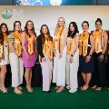 StudentswearinghonorsashesposeonstageattheWestVirginiaSchoolofOsteopathicMedicine