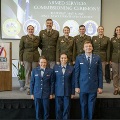UniformedstudentsposeonstageduringtheArmedServicesCommissioningCeremonyatVCOM-Louisiana