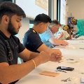 MedicalstudentsatPCOMSouthGeorgiaparticipateinahands-onsuturingworkshopinaclassroomsetting
