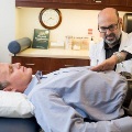 Adoctorperformsosteopathicmedicaltreatmentonapatient