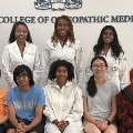 GroupofstudentsandfacultyposeforaphotoatTouroCollegeofOsteopathicMedicinewithsomewearingwhitecoatsandotherscasualclothing