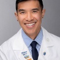 MichaelNysmilesinawhitecoat
