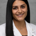 StudentdoctorSnehasmilesforaheadshotwearingherwhitecoat