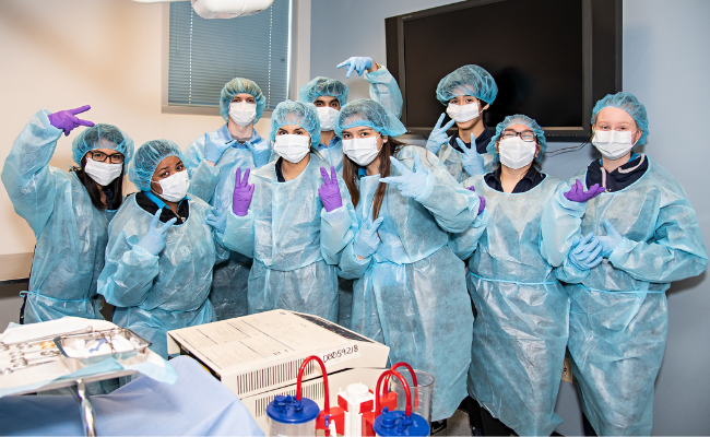 Group of students in medical gowns