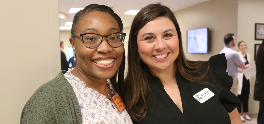 Admissions coordinator left welcomes new student