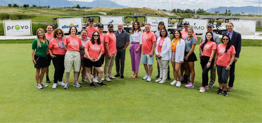 Students and faculty on golf green