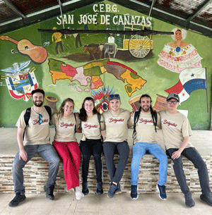 ICOM Students pose for a photo in Panama wearing matching Brigades tees.