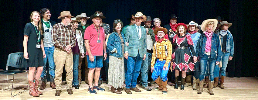 Group shot of WVSOM employees and retirees dressed in western gear 