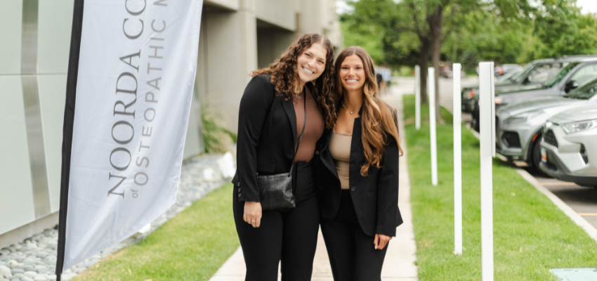 Two incoming NoordaCOM students pose on the school grounds