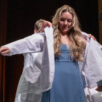 Student receives white coat