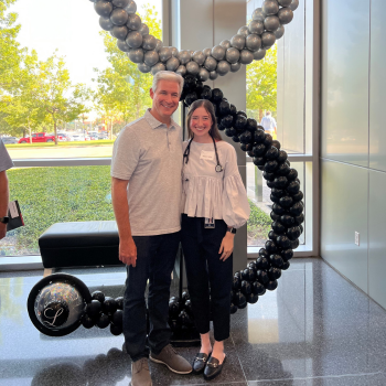 Allison and father standing in entrance to VCOM
