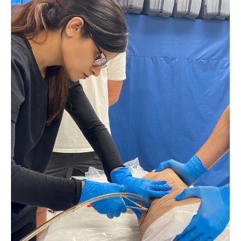 Student practices inserting a chest tube
