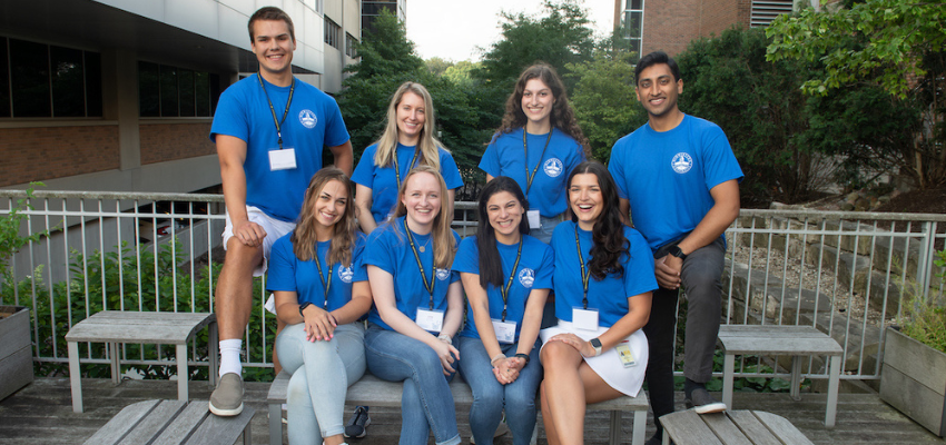 CCOM student mentors posing on a campus patio