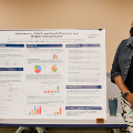 Studentsstandinfrontoftheirawardwinningresearchposter