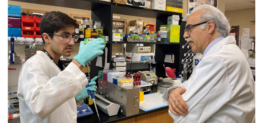 Student and faculty member in the lab