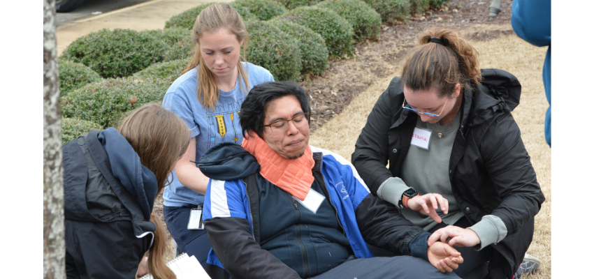 Students stabilize man outside