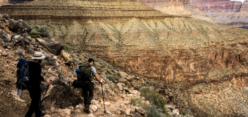 Students hiking down a canyon