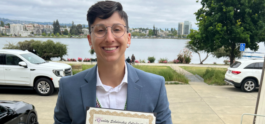 Student doctor Cori holds scholarship award