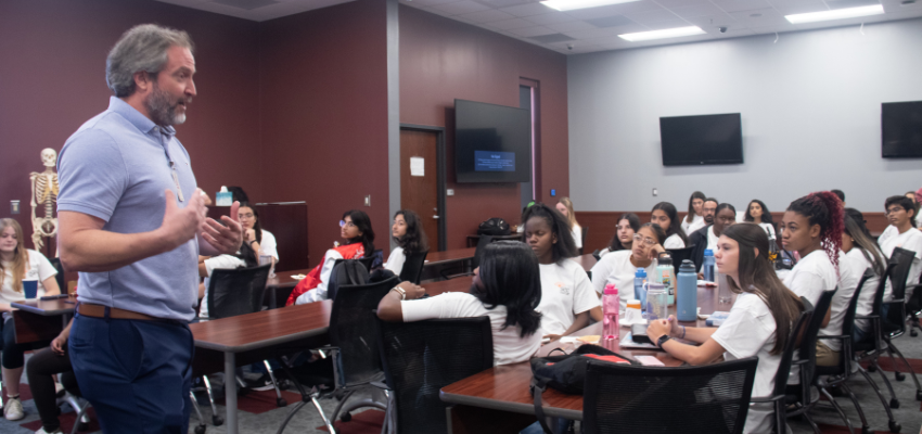 Faculty member addresses elementary school students