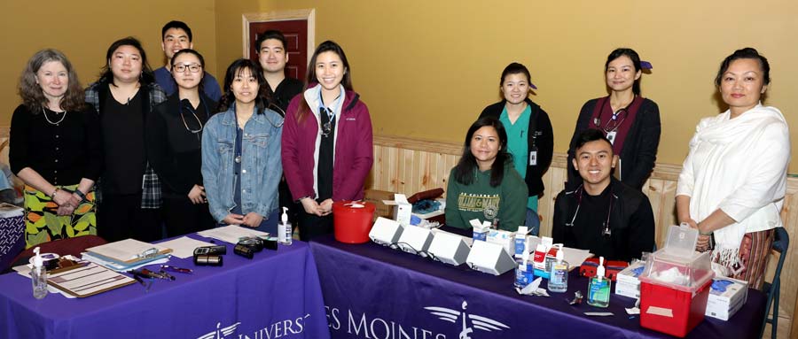 DMU students behind their display table