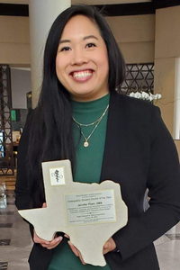 Medical Student Pham holds Texas-shaped award
