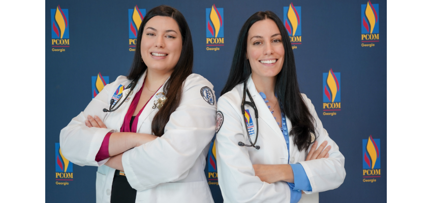 PCOM Georgia sisters stand with whitecoats and stethoscopes