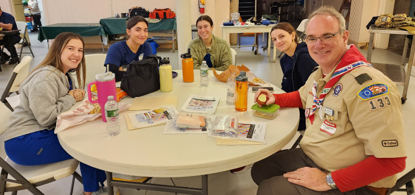 Dr. Lagenau sitting at a table with medical students