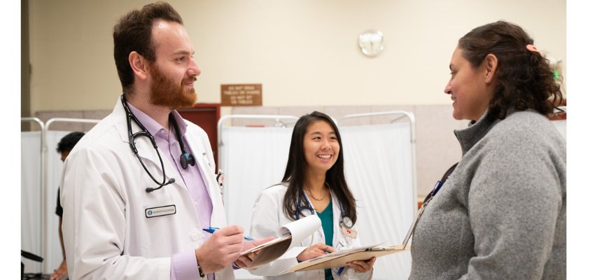 Students take information from a patient