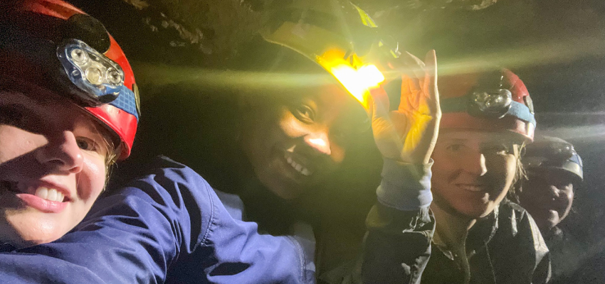 Medical students take a selfie inside the cave