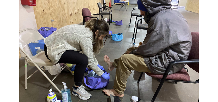 KCUCOM student provides foot examination