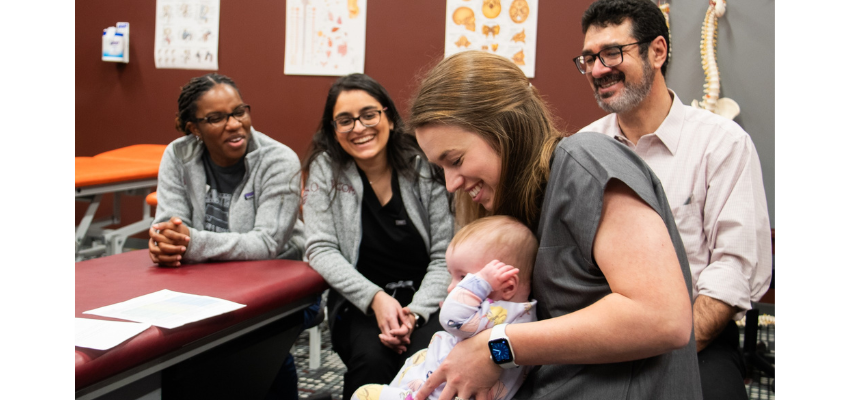 Medical student holding a baby