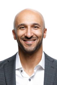 A professional headshot against a white background.