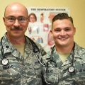 TwoUSAirForcemedicalpersonnelwearinguniformsandstethoscopesposetogetherindoors
