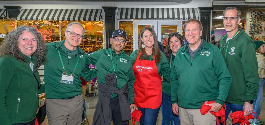 Michigan State University College of Osteopathic Medicine faculty, staff, and supporters pose together during a community volunteer event.