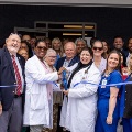 Facultyphysiciansandcommunitymembersgatherforaribbon-cuttingceremonycelebratingtheopeningofahealthcarefacility