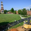 ConstructionequipmentworksbesidetheWVSOMcampuslawnasbuildingimprovementsorexpansionprojectstakeplace