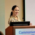 WomansmilingwhilespeakingatapodiumduringapresentationatCommonwealthHealthRegionalHospitalofScranton