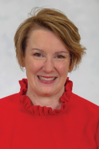 Dr. Sexton smiles for a professional headshot