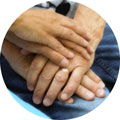Doctor and patient's hands clasping